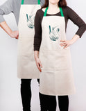 Apron with fennel screen print, designed by Curious Lions and made in the UK. This unisex natural cotton item makes a rustic gift.